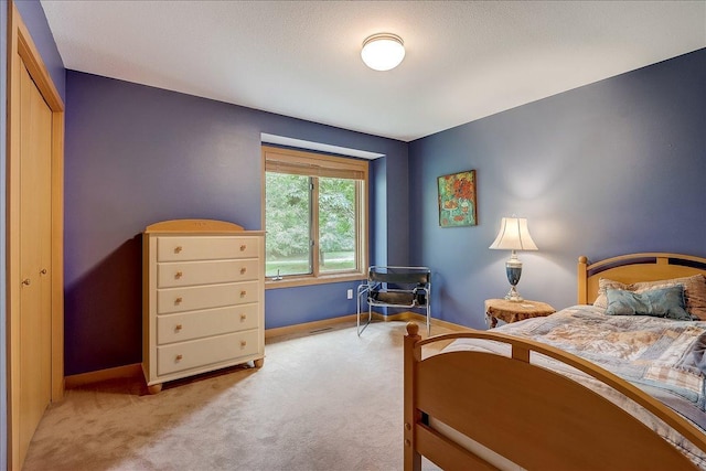 bedroom with light colored carpet