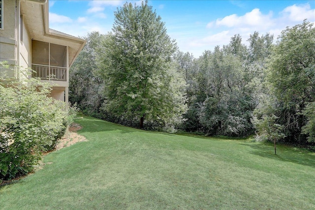 view of yard featuring a sunroom