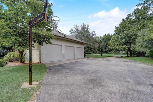 garage with a lawn