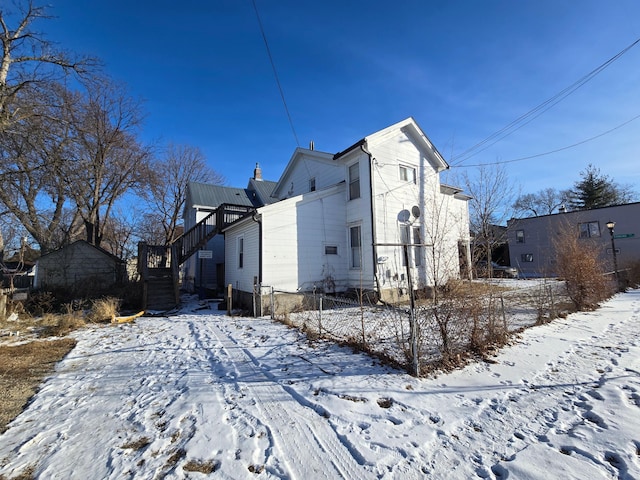 view of snow covered property