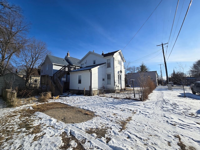 view of snow covered house