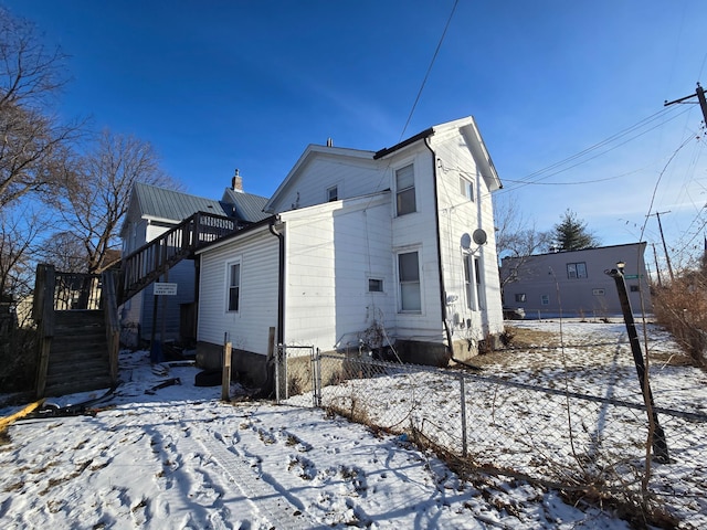 view of snow covered property