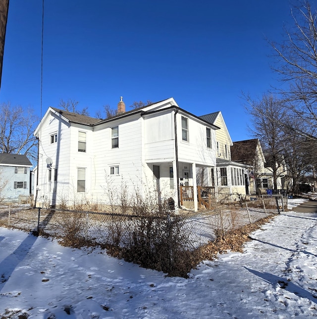 view of snow covered house