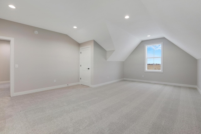 9568 63rd St S, Cottage Grove, MN 55016 - additional living space with lofted ceiling, light colored carpet, baseboards, and recessed lighting