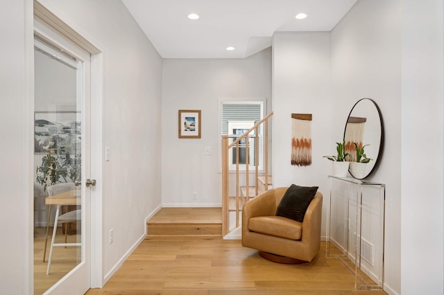 sitting room with light hardwood / wood-style flooring