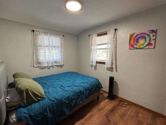 bedroom featuring dark hardwood / wood-style flooring