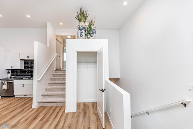 stairway with wood-type flooring