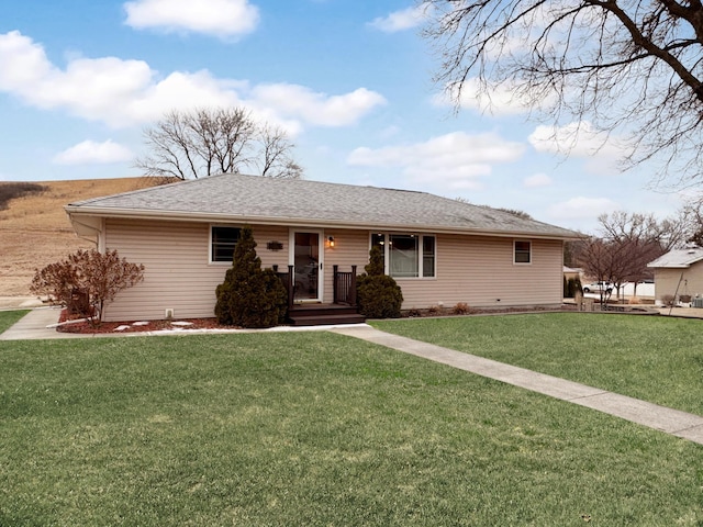 single story home with a front lawn