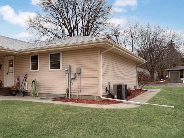 view of property exterior with cooling unit and a lawn