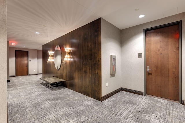 hallway featuring light carpet