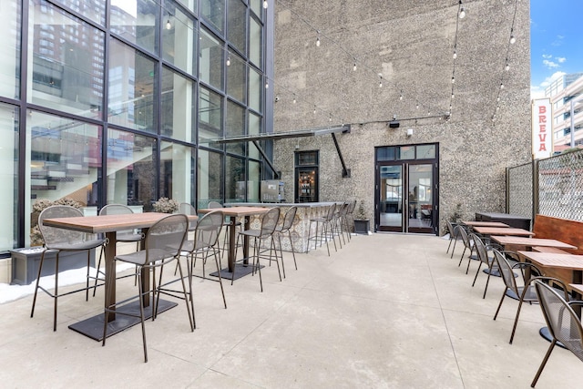 view of patio with an outdoor bar