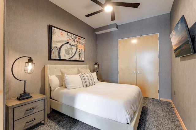 carpeted bedroom featuring a closet and ceiling fan