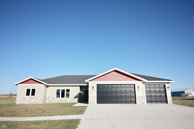 single story home with a garage and a front yard