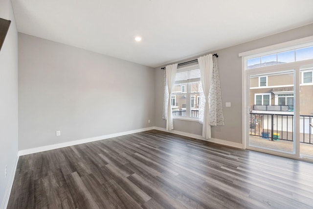 spare room featuring dark wood-type flooring