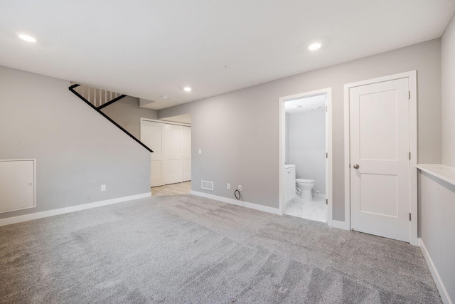 interior space featuring light colored carpet