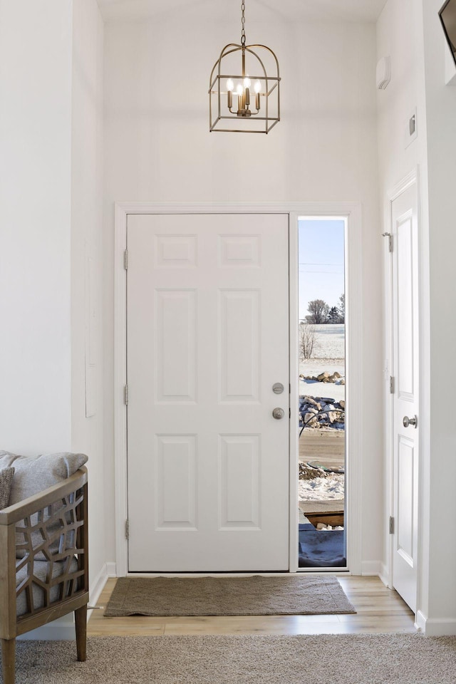 entryway featuring an inviting chandelier