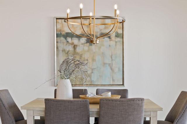 dining area featuring a notable chandelier