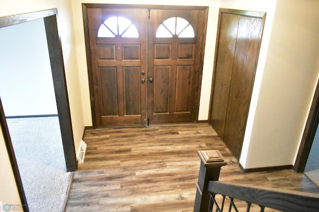 entrance foyer featuring wood-type flooring