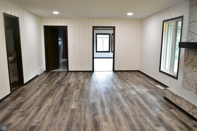 empty room featuring dark wood-type flooring