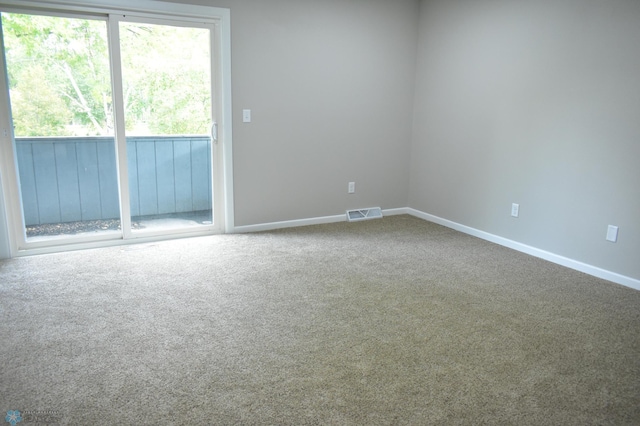 spare room featuring carpet flooring