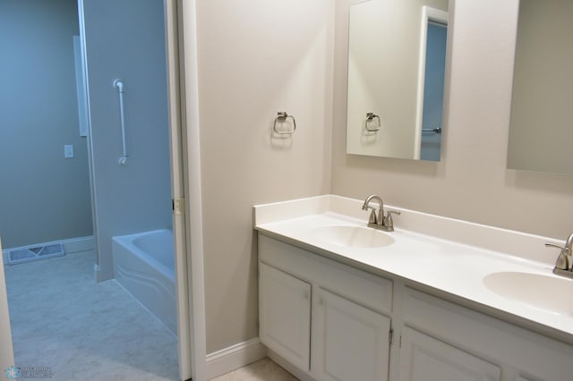 bathroom with vanity and a tub to relax in