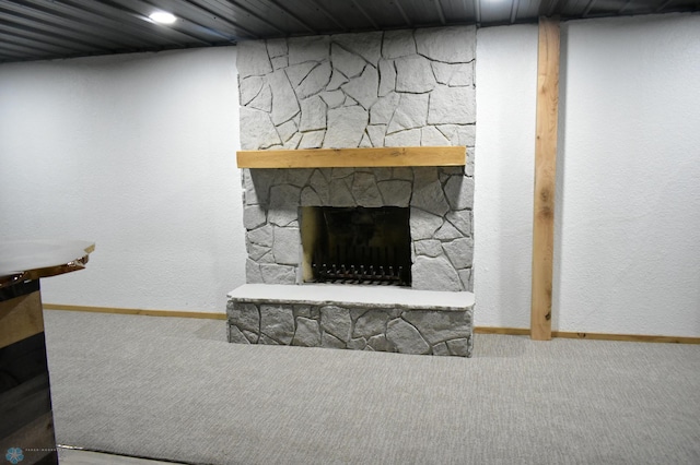 unfurnished living room with a fireplace and carpet