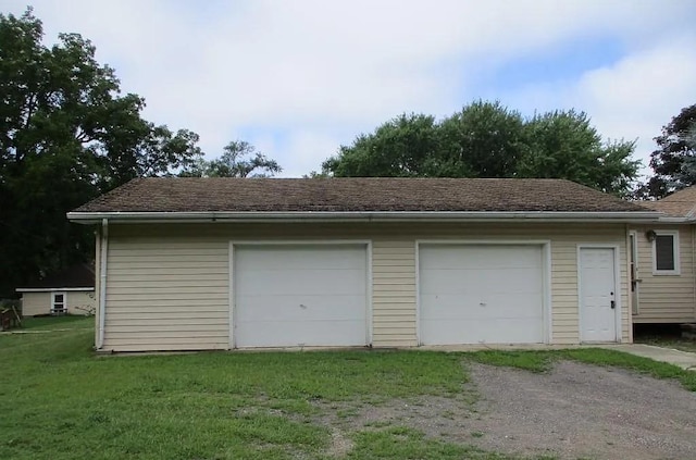 garage with a lawn