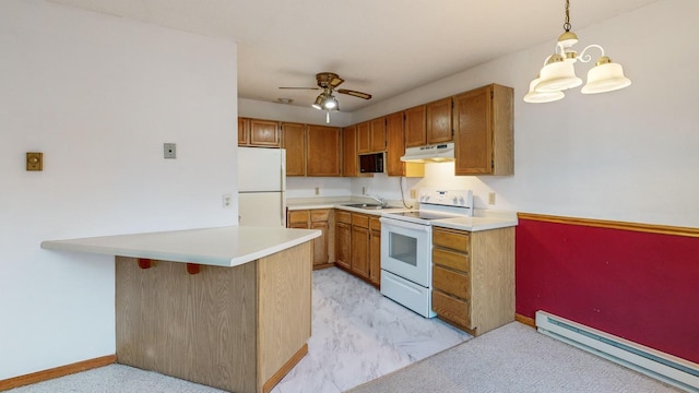 kitchen with pendant lighting, sink, baseboard heating, kitchen peninsula, and white appliances