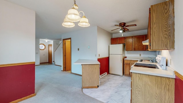 kitchen with decorative light fixtures, a baseboard radiator, white refrigerator, range, and ceiling fan