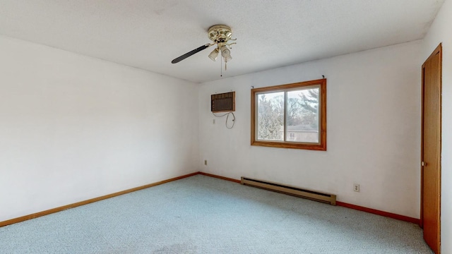 carpeted empty room with a baseboard radiator, a wall mounted AC, and ceiling fan