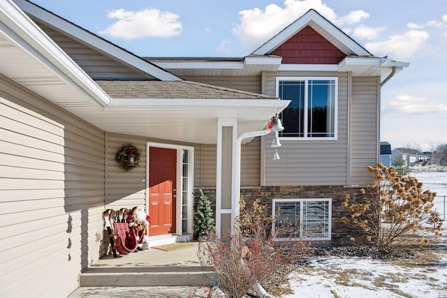 view of snow covered property entrance