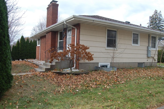 view of home's exterior featuring a yard