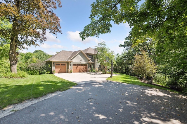 view of front of property with a garage and a front yard