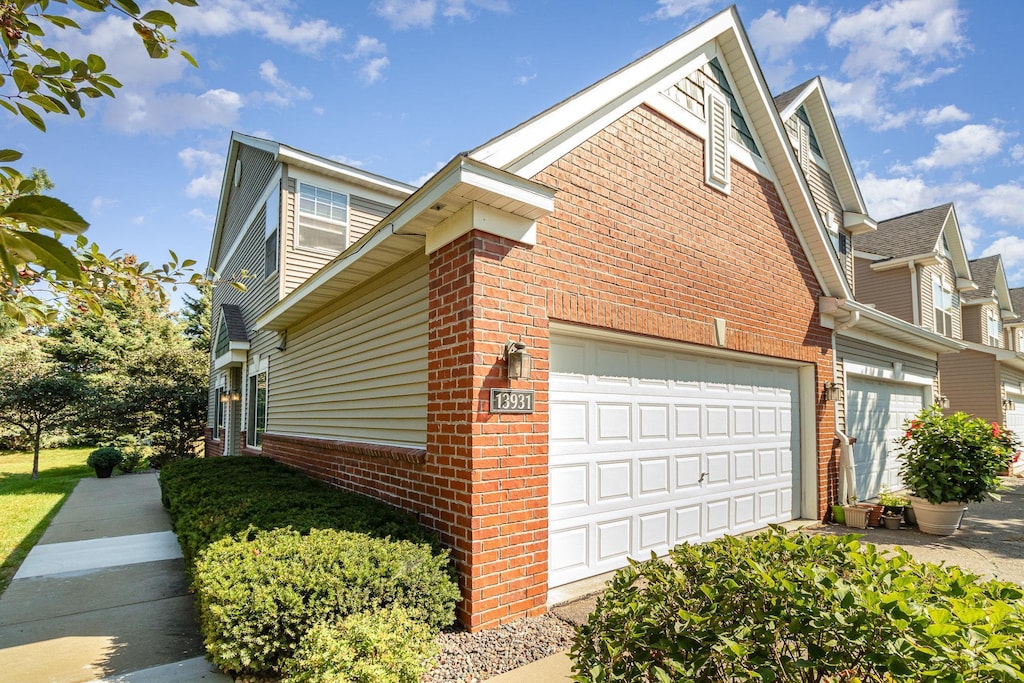 view of side of property with a garage