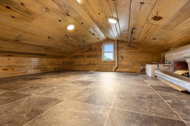 additional living space with wood ceiling, wooden walls, and vaulted ceiling