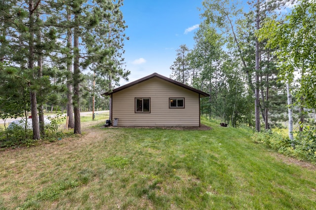 view of property exterior featuring a yard