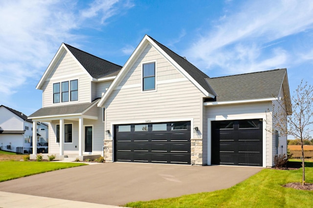 view of front of house with a porch and a front lawn