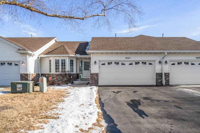 ranch-style home featuring a garage