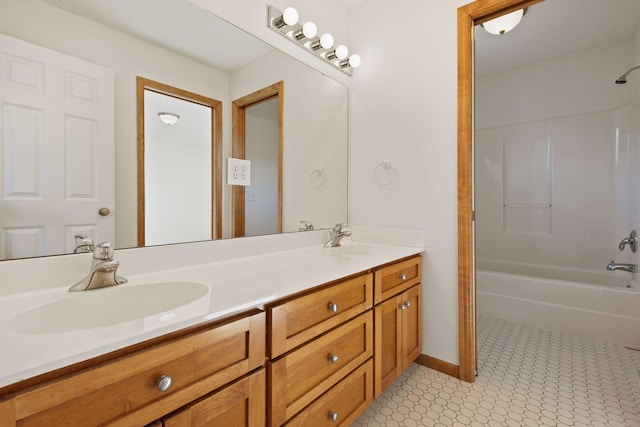 full bath with tub / shower combination, a sink, baseboards, and double vanity