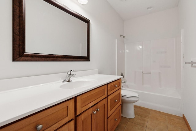 bathroom with toilet, tile patterned flooring, bathing tub / shower combination, and vanity