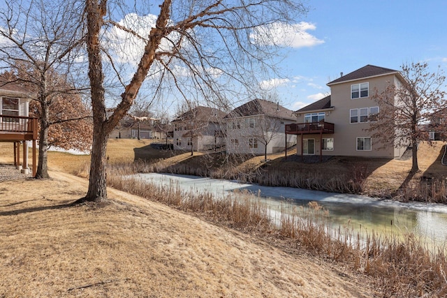 view of yard with a deck and a residential view