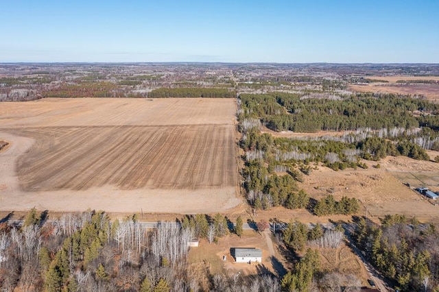 birds eye view of property with a rural view