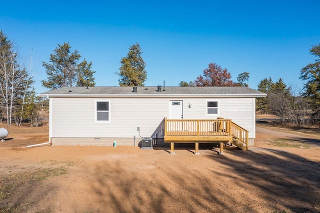 back of house featuring cooling unit and a deck