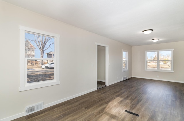 unfurnished room featuring dark hardwood / wood-style floors