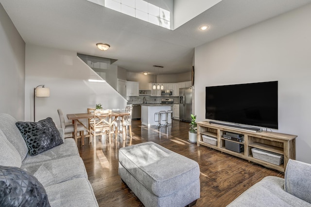 living room with dark hardwood / wood-style floors