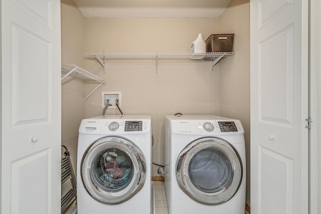 clothes washing area with independent washer and dryer