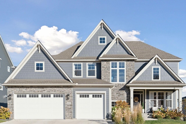 craftsman-style home featuring a garage and covered porch