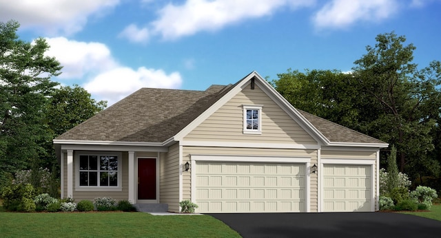 view of front of home featuring a garage and a front yard