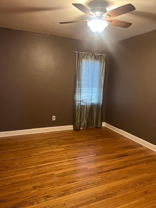 spare room featuring ceiling fan and light hardwood / wood-style flooring