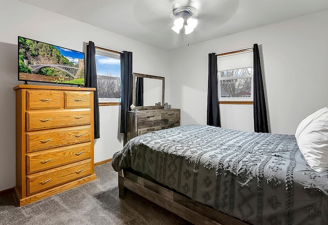 bedroom with dark carpet and ceiling fan